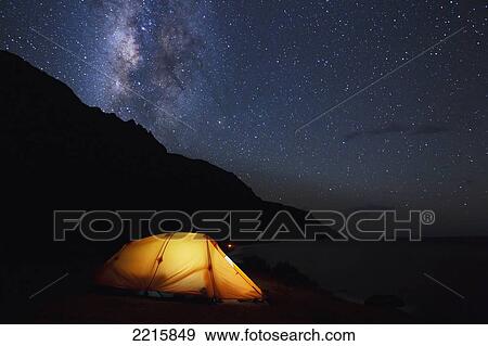 Hawaii, Kauai, Na Pali Coastline and Kalalau Mountains, Iluminated tent and star filled sky. View Large Photo Image Stock Photo - Hawaii, Kauai, Na Pali Coastline and Kalalau Mountains, Iluminated tent and star filled sky.. Fotosearch
