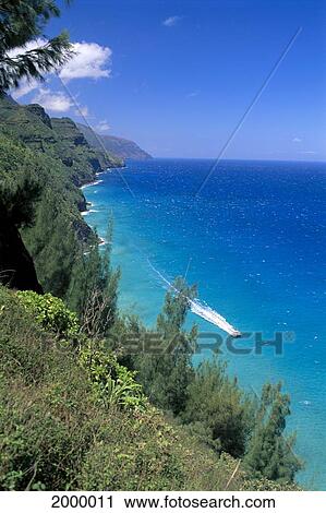 Hawaii, Kauai, Na Pali Coastline With Small Boat In Deep Blue Ocean, Blue Skies C1528 View Large Photo Image Stock Image - Hawaii, Kauai, Na Pali Coastline With Small Boat In Deep Blue Ocean, Blue Skies C1528. Fotosearch