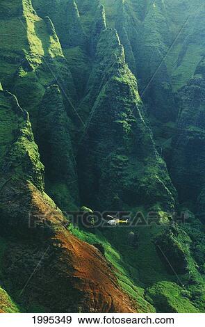 Stock Photo - Hawaii, Kauai, Napali Coast Aerial Along Rugged Cliffs, Helicopter Tour In Flight. Fotosearch