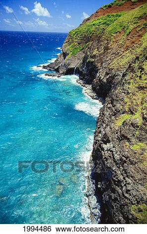 Hawaii, Kauai, Napali Coast Aerial Along Cliff, Small Waterfall Feeds Into Ocean View Large Photo Image Stock Photograph - Hawaii, Kauai, Napali Coast Aerial Along Cliff, Small Waterfall Feeds Into Ocean. Fotosearch