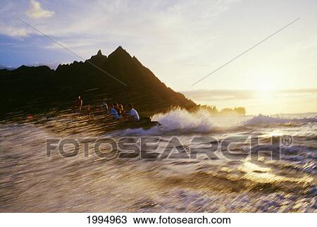Stock Image - Hawaii, Kauai, Napali Coast Many People In Zodiac, View Of Cliffs From Ocean, Sunset. Fotosearch