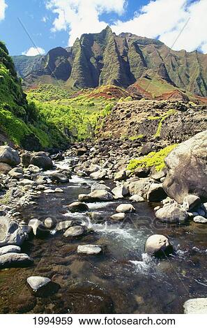 Hawaii, Kauai, Napali Coast, Stream Coming Down From The Kalalau Mountains View Large Photo Image Stock Photo - Hawaii, Kauai, Napali Coast, Stream Coming Down From The Kalalau Mountains. Fotosearch