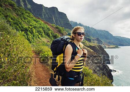 Hawaii, Kauai, Napali Coast, Woman Hiking on the Napali Coast Trail. View Large Photo Image Stock Photo - Hawaii, Kauai, Napali Coast, Woman Hiking on the Napali Coast Trail.. Fotosearch