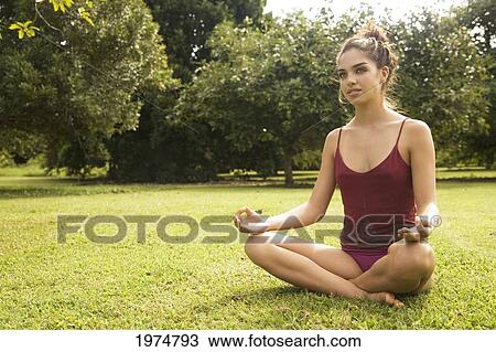 Hawaii, Kauai, North Shore, Beautiful Girl Excercising On Grassy Field. View Large Photo Image Stock Image - Hawaii, Kauai, North Shore, Beautiful Girl Excercising On Grassy Field.. Fotosearch