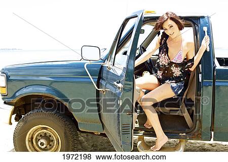 Hawaii, Kauai, North Shore, Beautiful Young Woman In A Grungy Pick-Up Truck. View Large Photo Image Stock Photo - Hawaii, Kauai, North Shore, Beautiful Young Woman In A Grungy Pick-Up Truck.. Fotosearch