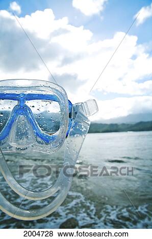 Stock Photo - Hawaii, Kauai, North Shore, Hanalei Bay, Snorkel Mask And Ocean In Background.. Fotosearch
