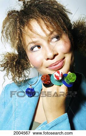 Stock Photo - Hawaii, Kauai, North Shore, Model Poses In Studio With Ring Candies.. Fotosearch