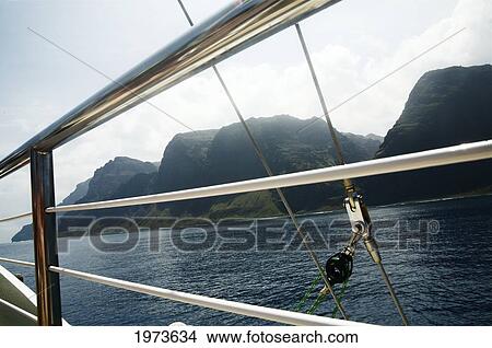 Hawaii, Kauai, North Shore, Na Pali Coast, Haena, With Rails From A Sailboat In The Foreground. View Large Photo Image Picture - Hawaii, Kauai, North Shore, Na Pali Coast, Haena, With Rails From A Sailboat In The Foreground.. Fotosearch