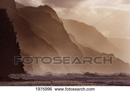 Stock Photograph - Hawaii, Kauai, North Shore, Na Pali Coast, Haena, Misty Waves At Dusk.. Fotosearch