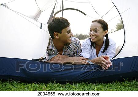 Hawaii, Kauai, North Shore, /Ncouple Gaze At Eachother In Tent. View Large Photo Image Stock Photography - Hawaii, Kauai, North Shore, /Ncouple Gaze At Eachother In Tent.. Fotosearch
