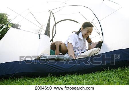 Hawaii, Kauai, North Shore, /Nyoung Couple Embrace While Camping In Tent. View Large Photo Image Stock Image - Hawaii, Kauai, North Shore, /Nyoung Couple Embrace While Camping In Tent.. Fotosearch
