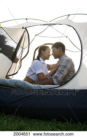 Hawaii, Kauai, North Shore, /Nyoung Couple Embraces In Tent. View Large Photo Image Stock Image - Hawaii, Kauai, North Shore, /Nyoung Couple Embraces In Tent.. Fotosearch