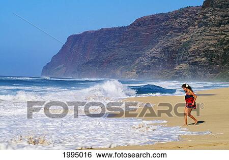 Hawaii, Kauai, Polihale Beach, Local Woman Wearing Pareo At Shorebreak View Large Photo Image Stock Photograph - Hawaii, Kauai, Polihale Beach, Local Woman Wearing Pareo At Shorebreak. Fotosearch