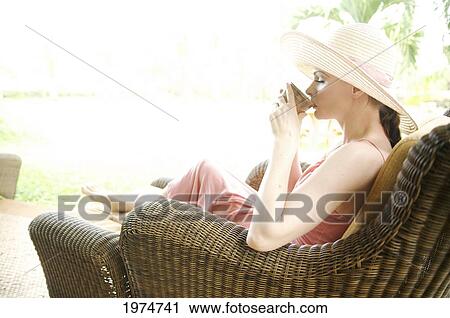 Hawaii, Kauai, Portrait Of A Beautiful Woman In A Pink Sundress Drinking Tea. View Large Photo Image Stock Image - Hawaii, Kauai, Portrait Of A Beautiful Woman In A Pink Sundress Drinking Tea.. Fotosearch
