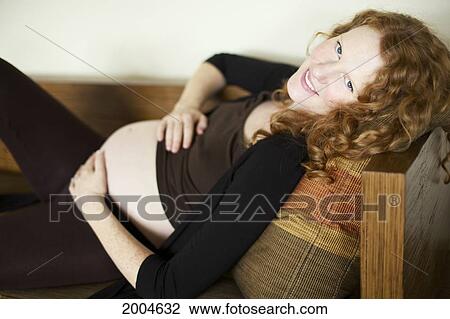 Hawaii, Kauai, Princeville, A Beautiful Pregnant Woman Poses With Her Belly. View Large Photo Image Stock Image - Hawaii, Kauai, Princeville, A Beautiful Pregnant Woman Poses With Her Belly.. Fotosearch