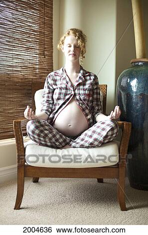Hawaii, Kauai, Princeville, A Pregnant Woman Meditates In Chair. View Large Photo Image Stock Photograph - Hawaii, Kauai, Princeville, A Pregnant Woman Meditates In Chair.. Fotosearch