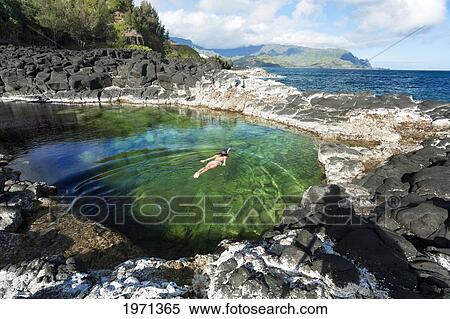 Stock Photography - Hawaii, Kauai, Princeville, Queens Bath, Woman Snorkeling In Saltwater Pool.. Fotosearch