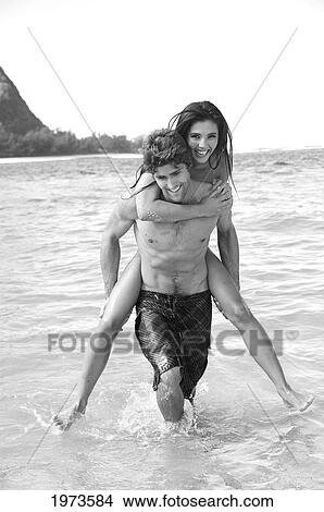 Hawaii, Kauai, Tunnels Beach, Beautiful Couple In The Water. View Large Photo Image Picture - Hawaii, Kauai, Tunnels Beach, Beautiful Couple In The Water.. Fotosearch