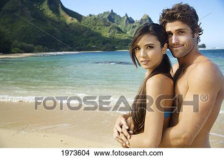 Picture - Hawaii, Kauai, Tunnels Beach, Beautiful Couple On The Beach.. Fotosearch