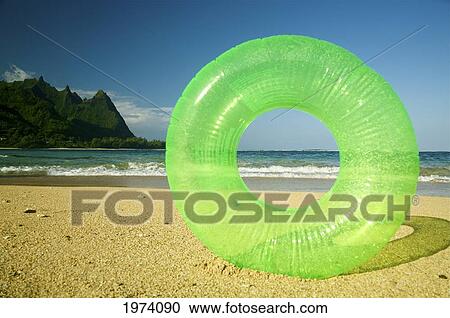 Hawaii, Kauai, Tunnels Beach, Green Innertube On The Beach. View Large Photo Image Stock Image - Hawaii, Kauai, Tunnels Beach, Green Innertube On The Beach.. Fotosearch