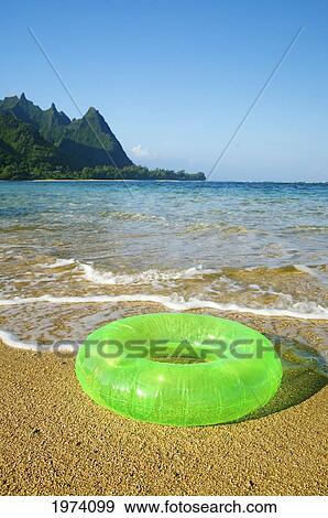 Hawaii, Kauai, Tunnels Beach, Green Innertube On The Beach. View Large Photo Image Stock Photo - Hawaii, Kauai, Tunnels Beach, Green Innertube On The Beach.. Fotosearch