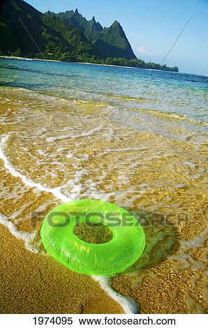 Hawaii, Kauai, Tunnels Beach, Green Innertube On The Beach. View Large Photo Image Stock Photography - Hawaii, Kauai, Tunnels Beach, Green Innertube On The Beach.. Fotosearch
