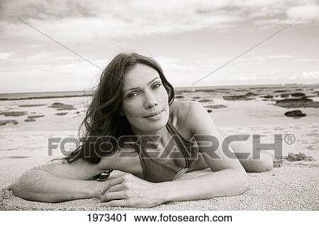 Stock Image - Hawaii, Kauai, Tunnel's Beach, Attractive Woman On The Beach.. Fotosearch