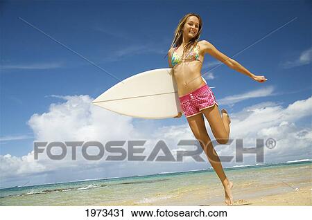 Hawaii, Kauai, Tunnels Beach, Surfer Girl Enjoying A Day Out. View Large Photo Image Stock Image - Hawaii, Kauai, Tunnels Beach, Surfer Girl Enjoying A Day Out.. Fotosearch