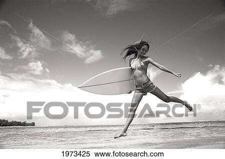 Hawaii, Kauai, Tunnels Beach, Surfer Girl Enjoying A Day Out, Black And White. View Large Photo Image Stock Photography - Hawaii, Kauai, Tunnels Beach, Surfer Girl Enjoying A Day Out, Black And White.. Fotosearch