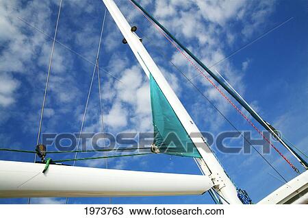 Stock Image - Hawaii, Kauai, View From Below Of The Sails Of A Sail Boat.. Fotosearch