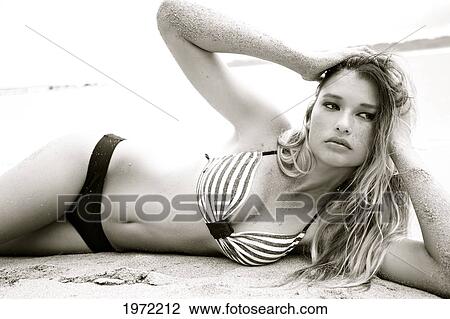 Hawaii, Kauai, Waikoko, Young Woman Models In A Bathing Suit On The Beach. View Large Photo Image Stock Image - Hawaii, Kauai, Waikoko, Young Woman Models In A Bathing Suit On The Beach.. Fotosearch