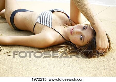 Hawaii, Kauai, Waikoko, Young Woman Models In A Bathing Suit On The Beach. View Large Photo Image Stock Photography - Hawaii, Kauai, Waikoko, Young Woman Models In A Bathing Suit On The Beach.. Fotosearch