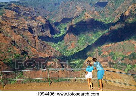 Hawaii, Kauai, Waimea Canyon, Couple Standing At Lookout Point View Large Photo Image Stock Photograph - Hawaii, Kauai, Waimea Canyon, Couple Standing At Lookout Point. Fotosearch