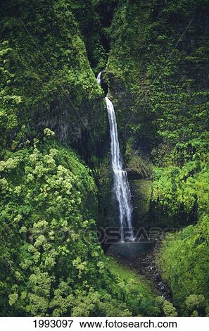 Stock Photo - Hawaii, Kauai, Waterfall On The Interior Regions Of The Island.. Fotosearch