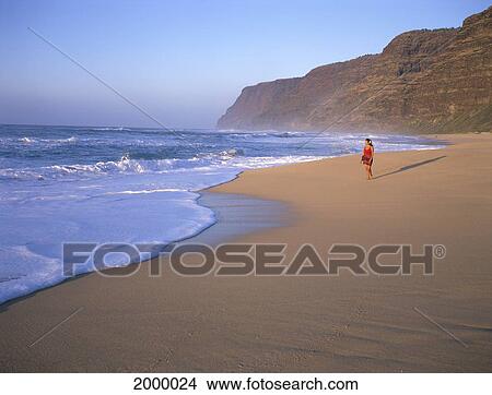 Picture - Hawaii, Kauai, Woman Walking Along Beach, Small Mountain, Blue Sky And Ocean. Fotosearch