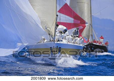 Stock Photo - Hawaii, Kenwood Cup, Close-Up Shot Of Bow Coming Straight For Camera, Yacht In Background. Fotosearch