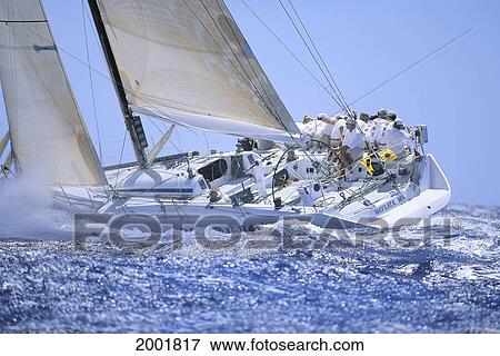 Stock Photo - Hawaii, Kenwood Cup Yacht Race, Side View Of Yacht And Crew, Leaning. Fotosearch