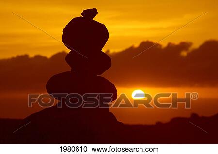 Stock Image - Hawaii, Lanai, Garden Of The Gods, Pile Of Rocks Silhouetted By Dramatic Sunset.. Fotosearch