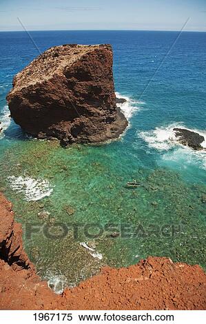 Stock Photography - Hawaii, Lanai, Hulopoe Bay, View Of Pu'u Pehe Rock (Sweetheart Rock), Man Stand-Up Paddle Boarding.. Fotosearch