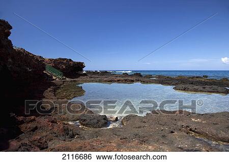 Stock Photograph - Hawaii, Lanai, Hulopoe, rocky shore and tidepool.. Fotosearch