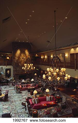 Stock Photo - Hawaii, Lanai, Lodge At Koele Grand Hall Lit With Lamps And Chandeliers.. Fotosearch