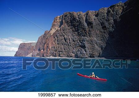 Hawaii, Lanai, Man In Red Kayak Along Cliffs South Coast Calm Ocean View Large Photo Image Stock Photo - Hawaii, Lanai, Man In Red Kayak Along Cliffs South Coast Calm Ocean. Fotosearch