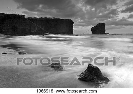Stock Photo - Hawaii, Lanai, Manele Bay, Hulopo'e Bay And Lanai Landmark Puu Pehe Also Known As Sweat Heart Rock, Black And White. Fotosearch