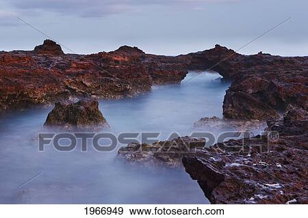 Stock Photo - Hawaii, Lanai, Manele Bay, Long Exposure Of Water Over Lava Formations In Hulopo`E Bay. Fotosearch