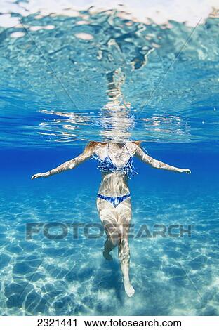 Hawaii, Lanai, Manele Bay, Young Woman Standing In Shallow Water. View Large Photo Image Stock Image - Hawaii, Lanai, Manele Bay, Young Woman Standing In Shallow Water.. Fotosearch
