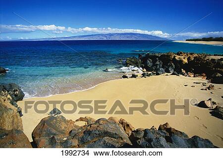 Picture - Hawaii, Lanai, Polihua Beach; Footprints In Sand, Rocks Around Beach, Molokai In Distance. Fotosearch