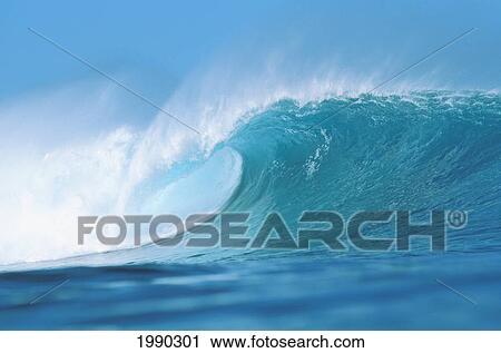 Stock Image - Hawaii, Large Blue Wave Breaks Toward Shoreline. Fotosearch
