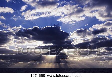 Stock Photo - Hawaii, Late Afternoon Rain Clouds Over Ocean Horizon.. Fotosearch