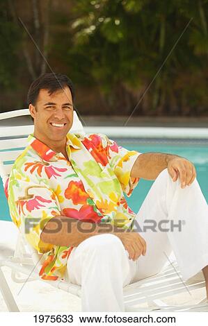Hawaii, Local Man Sitting In Lawn Chair By The Pool. View Large Photo Image Stock Image - Hawaii, Local Man Sitting In Lawn Chair By The Pool.. Fotosearch