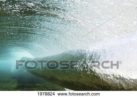 Picture - Hawaii, Long Blue Curl Of A Wave From Underwater.. Fotosearch